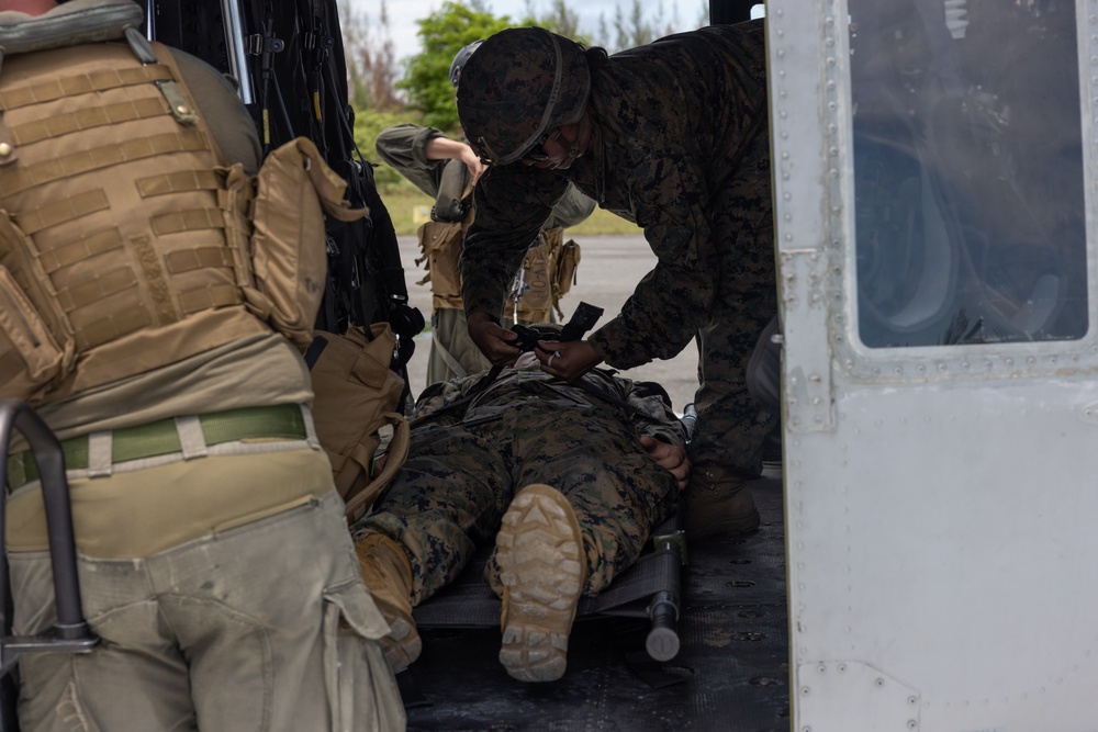 U.S. Marines and Sailors conduct simulated casualty evacuation operations during Distributed Aviation Operations Exercise 24
