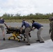 U.S. Marines and Sailors conduct simulated casualty evacuation operations during Distributed Aviation Operations Exercise 24