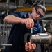 USS Ronald Reagan (CVN 76) Sailors fabricate parts in machine repair shop