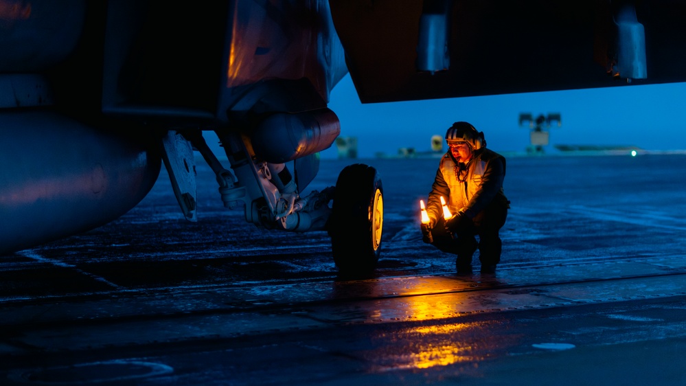Aircraft Handlers Move Aircraft at Dawn
