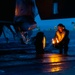 Aircraft Handlers Move Aircraft at Dawn