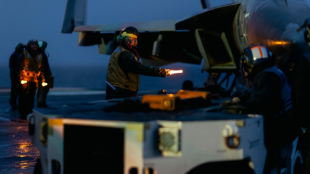 Aircraft Handlers Move Aircraft at Dawn