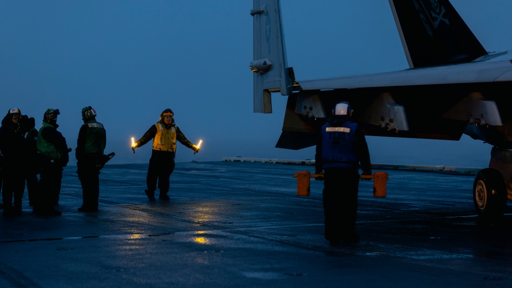 Aircraft Handlers Move Aircraft at Dawn