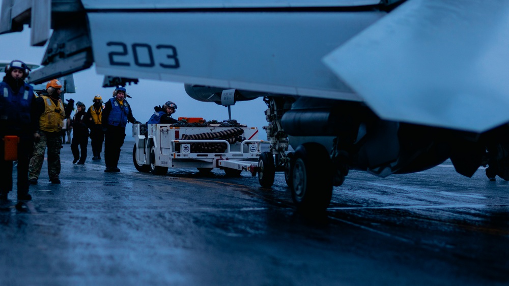 Aircraft Handlers Move Aircraft at Dawn