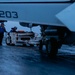 Aircraft Handlers Move Aircraft at Dawn