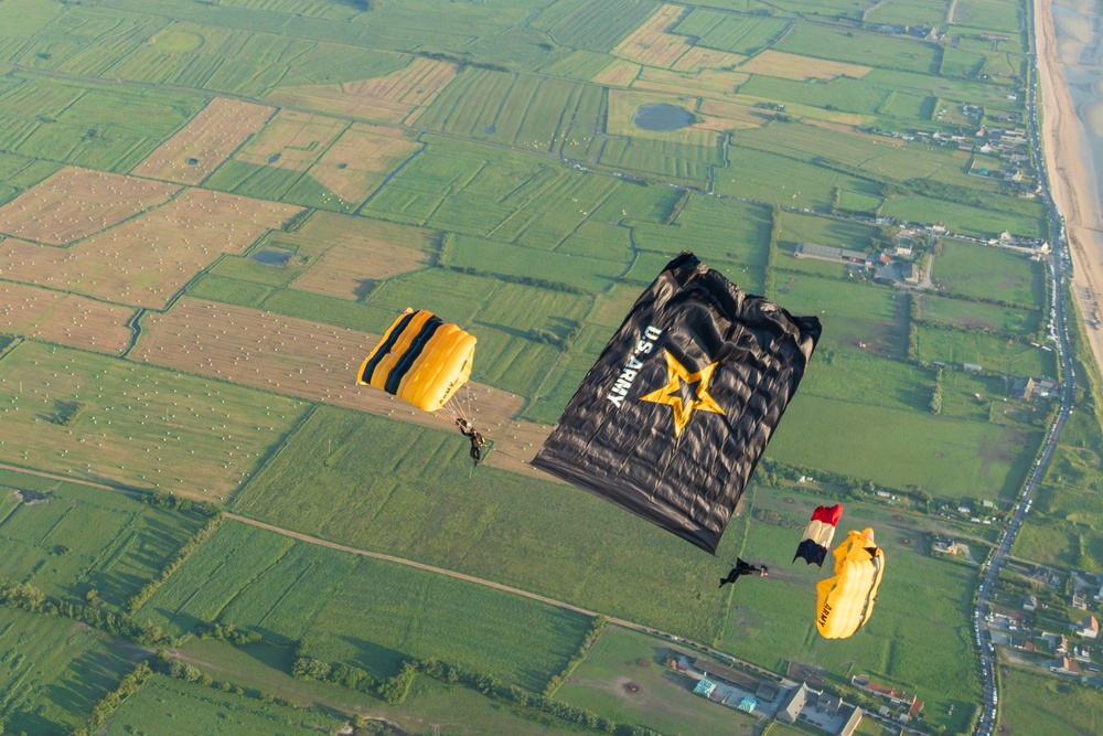 Soldiers from Army Golden Knights jump onto Utah Beach in Normandy, France for D-Day commemoration ceremonies