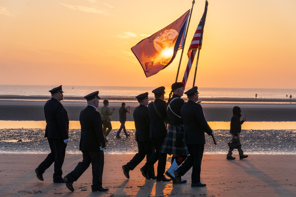 Supporters march in United States colors in Normandy, France for D-Day commemoration ceremonies