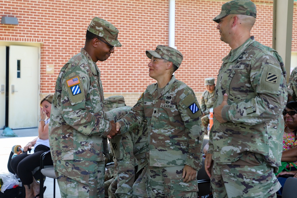 Commanders Pass Company Guidon in Change of Command