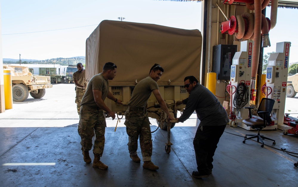 Miltechs with the 63rd help out