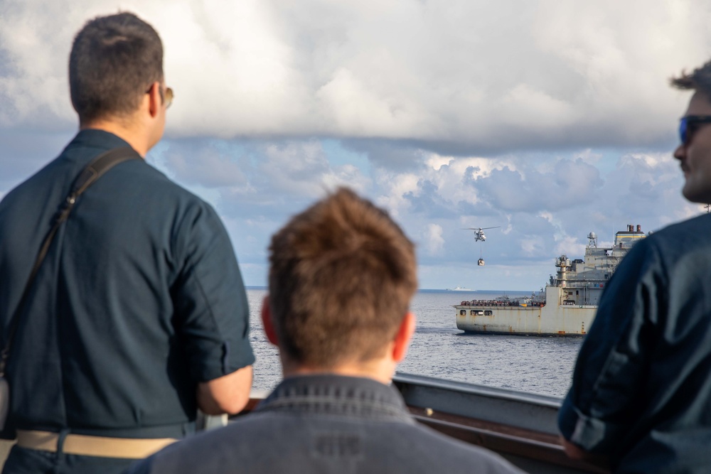 USS Russell (DDG 59) receives over 100 pallets worth of supplies during a vertical replenishment with USNS Wally Schirra (T-AKE 8)