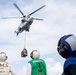 USS Russell (DDG 59) receives over 100 pallets worth of supplies during a vertical replenishment with USNS Wally Schirra (T-AKE 8)