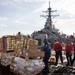 USS Russell (DDG 59) receives over 100 pallets worth of supplies during a vertical replenishment with USNS Wally Schirra (T-AKE 8)