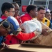 USS Russell (DDG 59) receives over 100 pallets worth of supplies during a vertical replenishment with USNS Wally Schirra (T-AKE 8)