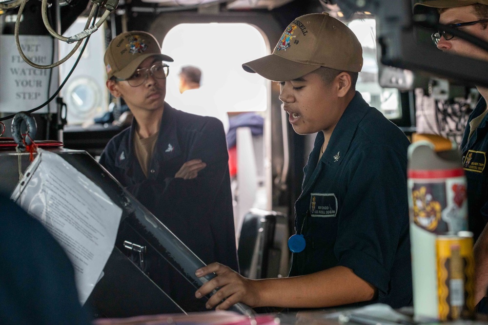 USS Russell (DDG 59) transits out of the Republic of Singapore