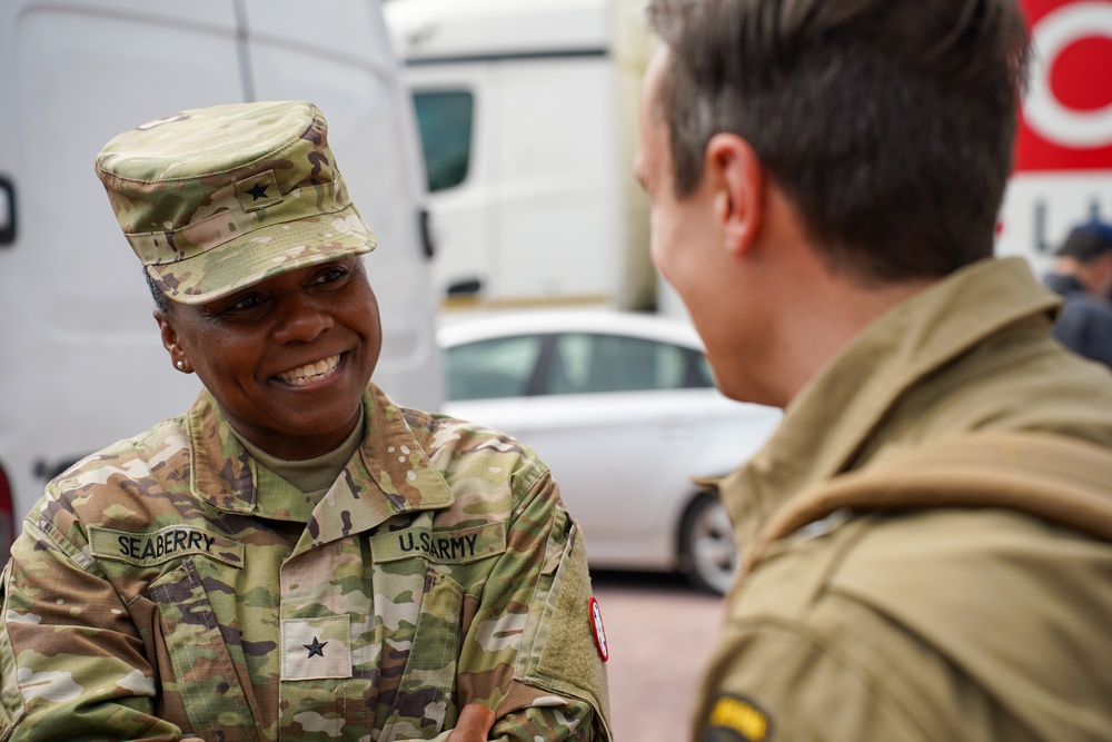 Brig. Gen. Tomika Seaberry speaks with locals during DDay 80 Commemoration