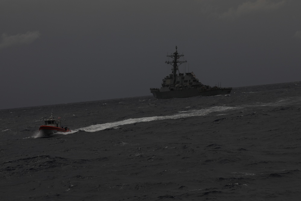 US Coast Guard Cutter Stone conducts small boat operations with USS Donald Cook