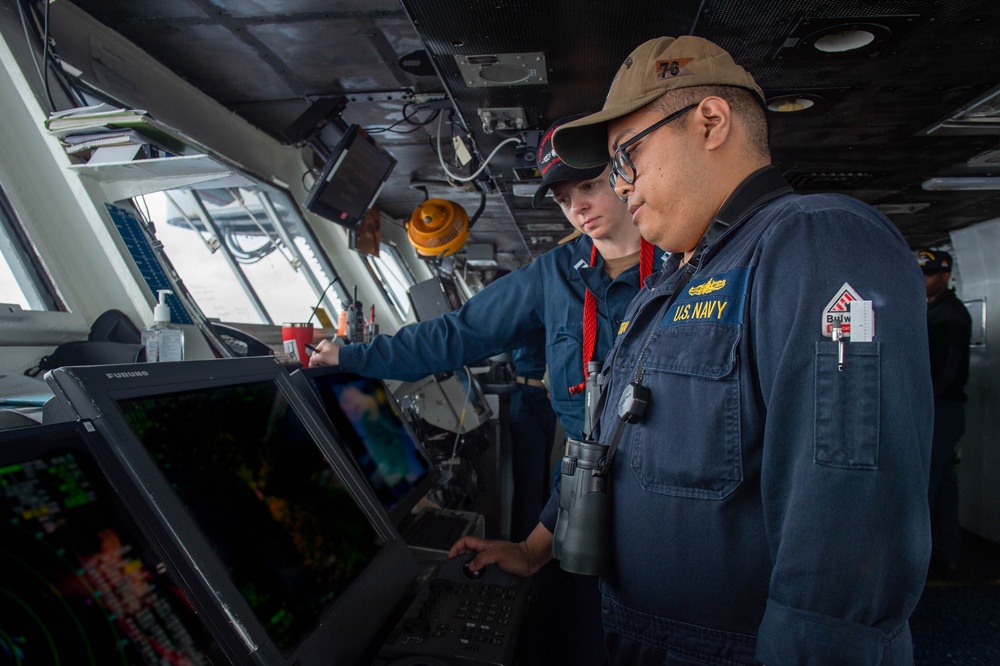 USS Ronald Reagan (CVN 76) Sailors stand watch in the pilot house