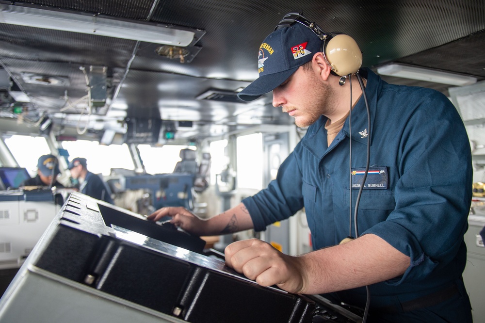 USS Ronald Reagan (CVN 76) Sailors stand watch in the pilot house