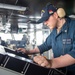 USS Ronald Reagan (CVN 76) Sailors stand watch in the pilot house