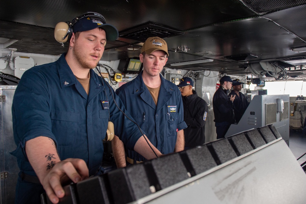 USS Ronald Reagan (CVN 76) Sailors stand watch in the pilot house