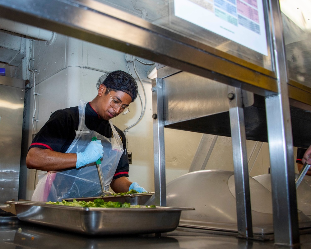 USS Carl Vinson (CVN 70) Sailor Prepares to Serve Lunch