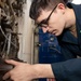 USS Carl Vinson (CVN 70) Sailor Performs Preventative Maintenance on a Fire Pump