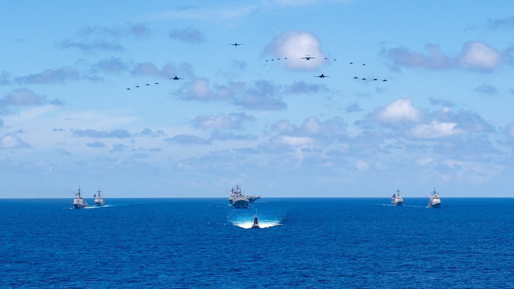 USS Ronald Reagan (CVN 76) steams in formation with 7th Fleet ships, Japan Maritime Self-Defense Force ships, as U.S. Navy, U.S. Air Force and Japan Air Self-Defense Force aircraft fly over in support of Valiant Shield 2024