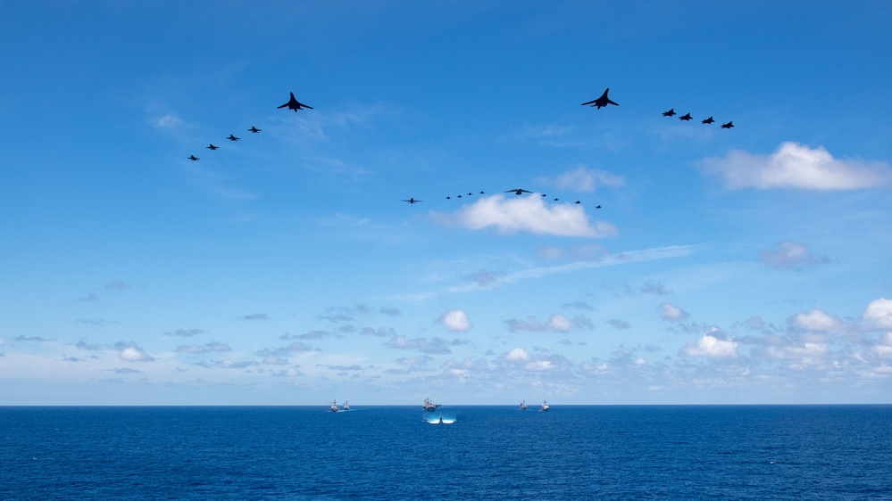 USS Ronald Reagan (CVN 76) steams in formation with 7th Fleet ships, Japan Maritime Self-Defense Force ships, as U.S. Navy, U.S. Air Force and Japan Air Self-Defense Force aircraft fly over in support of Valiant Shield 2024