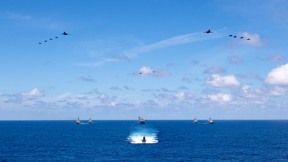 USS Ronald Reagan (CVN 76) steams in formation with 7th Fleet ships, Japan Maritime Self-Defense Force ships, as U.S. Navy, U.S. Air Force and Japan Air Self-Defense Force aircraft fly over in support of Valiant Shield 2024