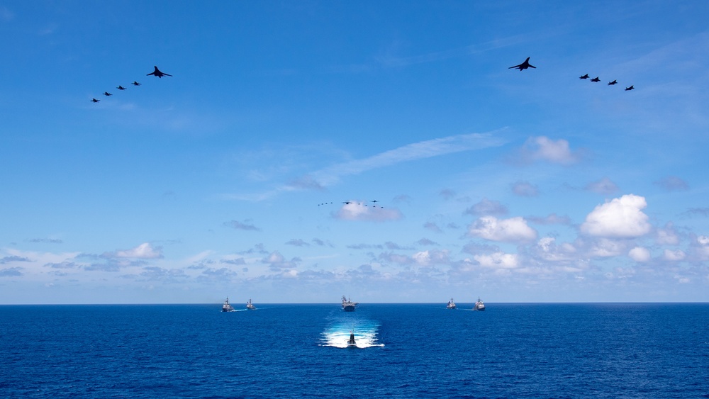 USS Ronald Reagan (CVN 76) steams in formation with 7th Fleet ships, Japan Maritime Self-Defense Force ships, as U.S. Navy, U.S. Air Force and Japan Air Self-Defense Force aircraft fly over in support of Valiant Shield 2024