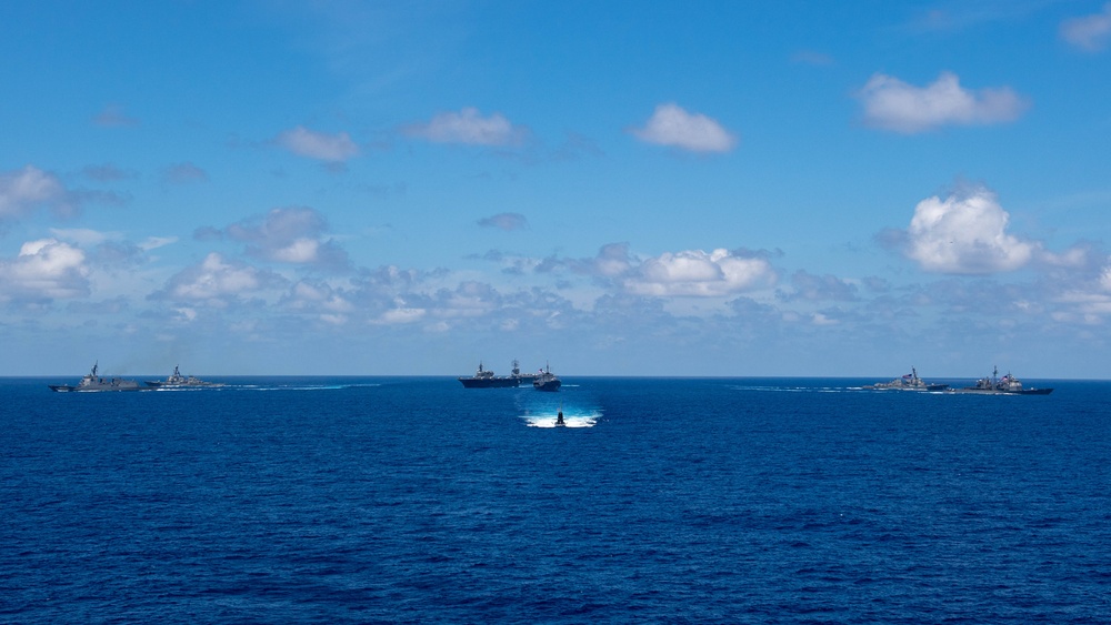 USS Ronald Reagan (CVN 76) steams in formation with 7th Fleet ships, Japan Maritime Self-Defense Force ships, as U.S. Navy, U.S. Air Force and Japan Air Self-Defense Force aircraft fly over in support of Valiant Shield 2024