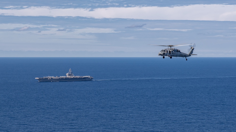 USS Ronald Reagan (CVN 76) steams in formation with 7th Fleet ships, Japan Maritime Self-Defense Force ships, as U.S. Navy, U.S. Air Force and Japan Air Self-Defense Force aircraft fly over in support of Valiant Shield 2024