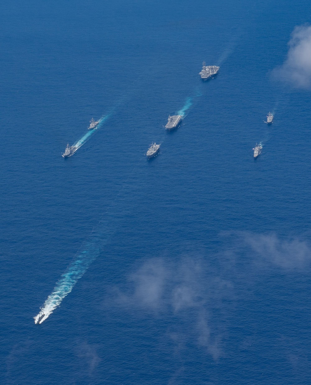 USS Ronald Reagan (CVN 76) steams in formation with 7th Fleet ships, Japan Maritime Self-Defense Force ships, as U.S. Navy, U.S. Air Force and Japan Air Self-Defense Force aircraft fly over in support of Valiant Shield 2024