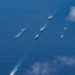 USS Ronald Reagan (CVN 76) steams in formation with 7th Fleet ships, Japan Maritime Self-Defense Force ships, as U.S. Navy, U.S. Air Force and Japan Air Self-Defense Force aircraft fly over in support of Valiant Shield 2024