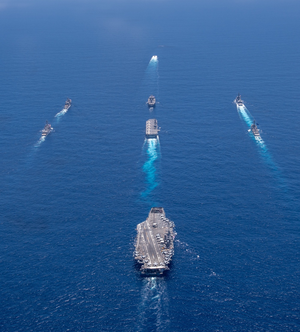 USS Ronald Reagan (CVN 76) steams in formation with 7th Fleet ships, Japan Maritime Self-Defense Force ships, as U.S. Navy, U.S. Air Force and Japan Air Self-Defense Force aircraft fly over in support of Valiant Shield 2024