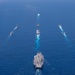 USS Ronald Reagan (CVN 76) steams in formation with 7th Fleet ships, Japan Maritime Self-Defense Force ships, as U.S. Navy, U.S. Air Force and Japan Air Self-Defense Force aircraft fly over in support of Valiant Shield 2024