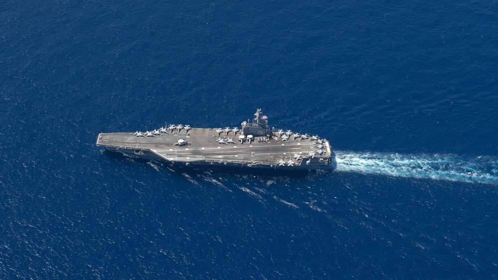 USS Ronald Reagan (CVN 76) steams in formation with 7th Fleet ships, Japan Maritime Self-Defense Force ships, as U.S. Navy, U.S. Air Force and Japan Air Self-Defense Force aircraft fly over in support of Valiant Shield 2024