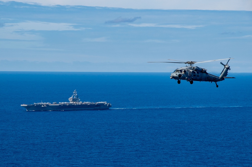 USS Ronald Reagan (CVN 76) steams in formation with 7th Fleet ships, Japan Maritime Self-Defense Force ships, as U.S. Navy, U.S. Air Force and Japan Air Self-Defense Force aircraft fly over in support of Valiant Shield 2024