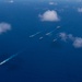 USS Ronald Reagan (CVN 76) steams in formation with 7th Fleet ships, Japan Maritime Self-Defense Force ships, as U.S. Navy, U.S. Air Force and Japan Air Self-Defense Force aircraft fly over in support of Valiant Shield 2024