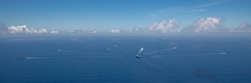 USS Ronald Reagan (CVN 76) steams in formation with 7th Fleet ships, Japan Maritime Self-Defense Force ships, as U.S. Navy, U.S. Air Force and Japan Air Self-Defense Force aircraft fly over in support of Valiant Shield 2024