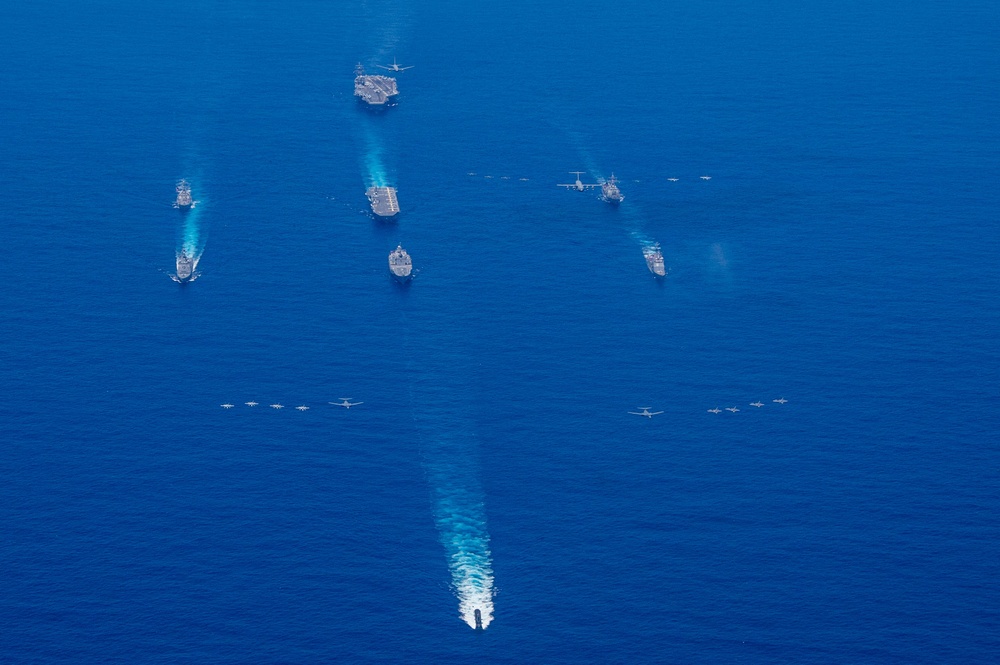 USS Ronald Reagan (CVN 76) steams in formation with 7th Fleet ships, Japan Maritime Self-Defense Force ships, as U.S. Navy, U.S. Air Force and Japan Air Self-Defense Force aircraft fly over in support of Valiant Shield 2024