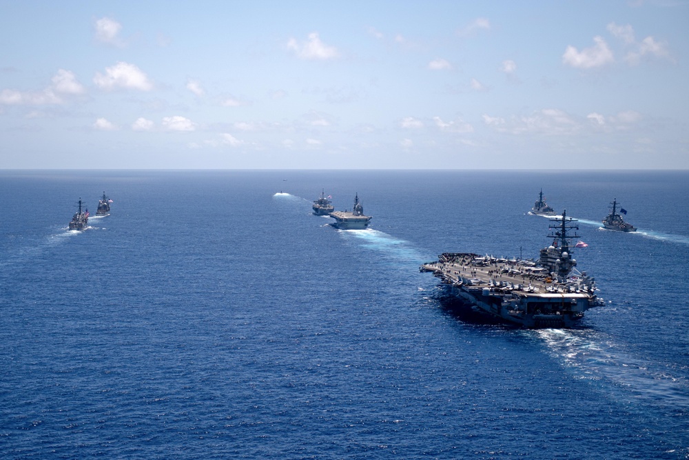 USS Ronald Reagan (CVN 76) steams in formation with 7th Fleet ships, Japan Maritime Self Defense Force ships, as U.S. Navy, U.S. Air Force and Japan Air Self-Defense Force aircraft fly over in support of Valiant Shield 2024