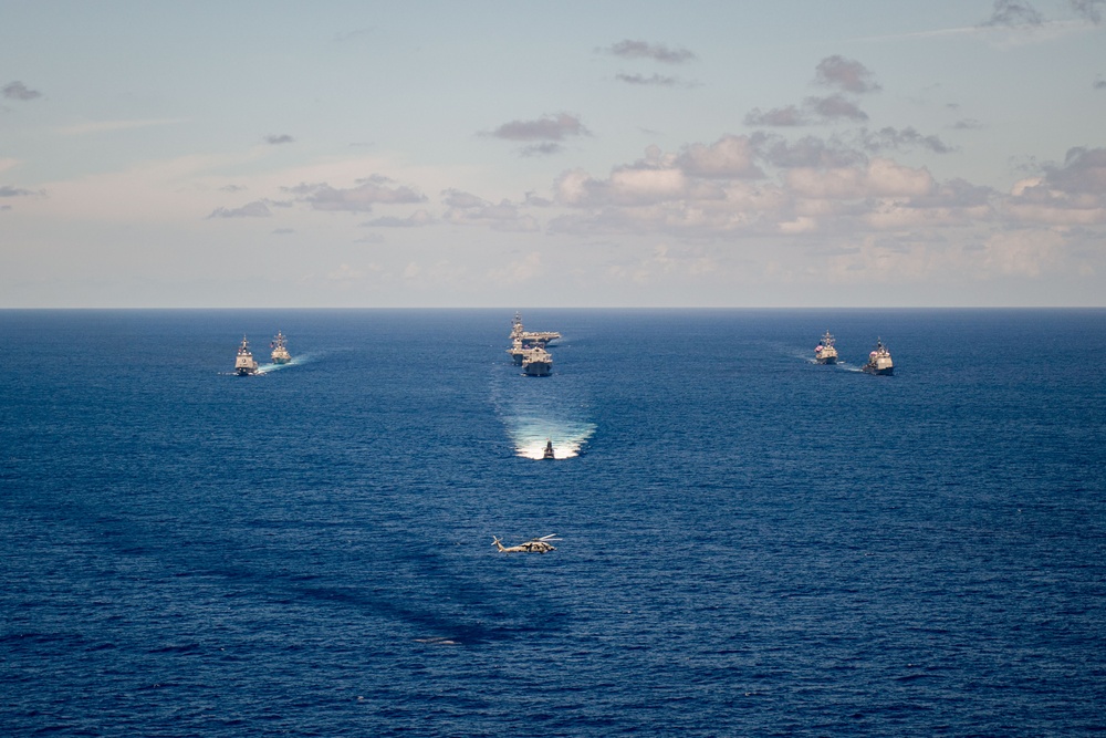 USS Ronald Reagan (CVN 76) steams in formation with 7th Fleet ships, Japan Maritime Self Defense Force ships, as U.S. Navy, U.S. Air Force and Japan Air Self-Defense Force aircraft fly over in support of Valiant Shield 2024