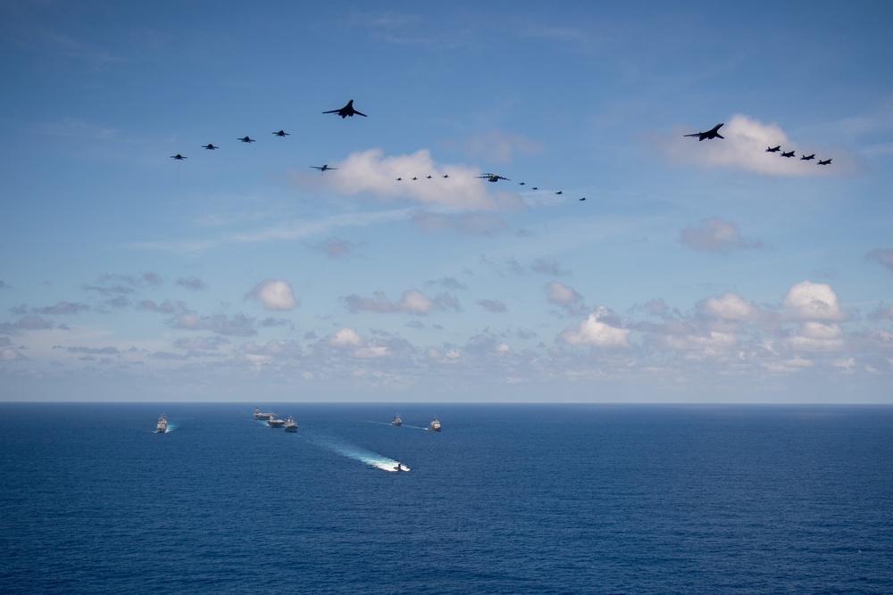 USS Ronald Reagan (CVN 76) steams in formation with 7th Fleet ships, Japan Maritime Self Defense Force ships, as U.S. Navy, U.S. Air Force and Japan Air Self-Defense Force aircraft fly over in support of Valiant Shield 2024