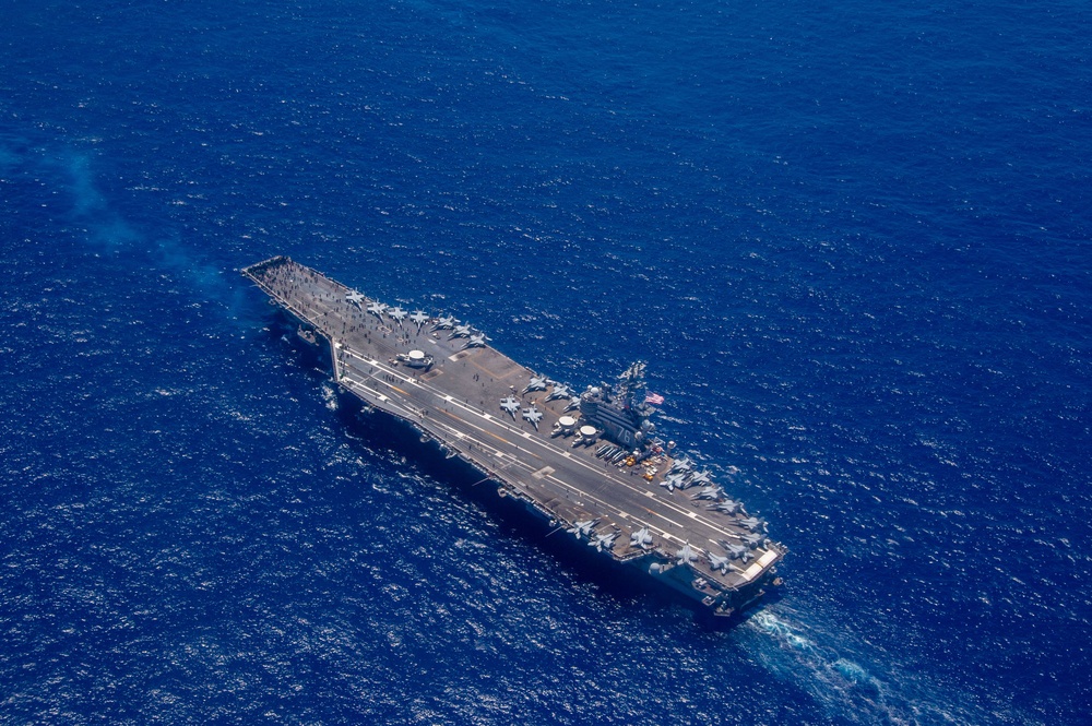 USS Ronald Reagan (CVN 76) steams in formation with 7th Fleet ships, Japan Maritime Self-Defense Force ships, as U.S. Navy, U.S. Air Force and Japan Air Self-Defense Force aircraft fly over in support of Valiant Shield 2024