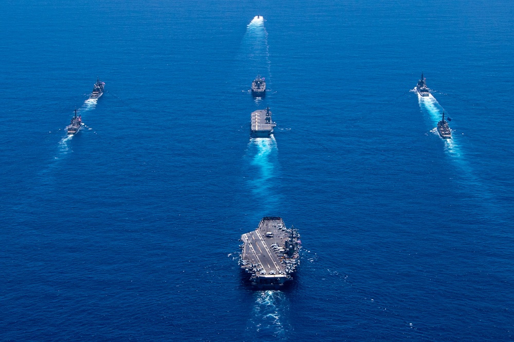 USS Ronald Reagan (CVN 76) steams in formation with 7th Fleet ships, Japan Maritime Self-Defense Force ships, as U.S. Navy, U.S. Air Force and Japan Air Self-Defense Force aircraft fly over in support of Valiant Shield 2024