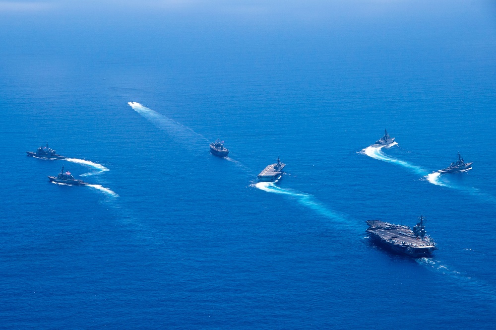 USS Ronald Reagan (CVN 76) steams in formation with 7th Fleet ships, Japan Maritime Self-Defense Force ships, as U.S. Navy, U.S. Air Force and Japan Air Self-Defense Force aircraft fly over in support of Valiant Shield 2024