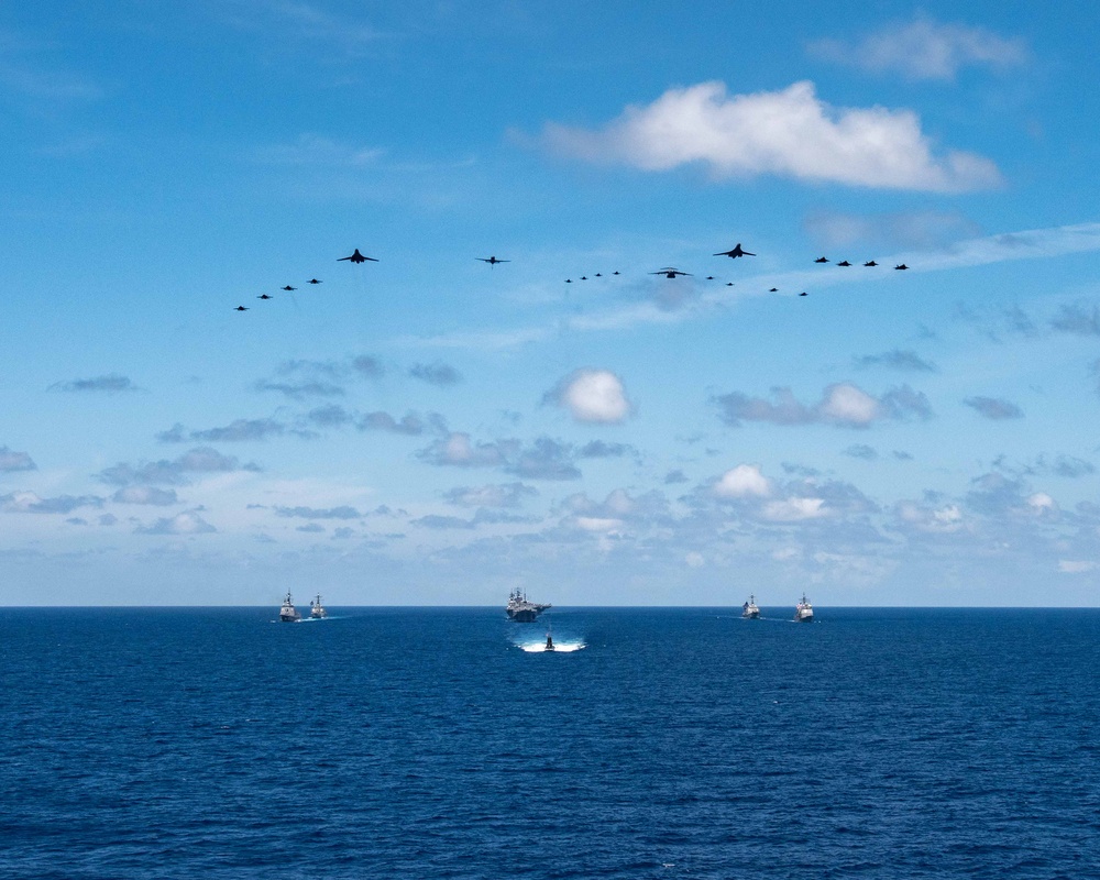 USS Ronald Reagan (CVN 76) steams in formation with 7th Fleet ships, Japan Maritime Self-Defense Force ships, as U.S. Navy, U.S. Air Force and Japan Air Self-Defense Force aircraft fly over in support of Valiant Shield 2024