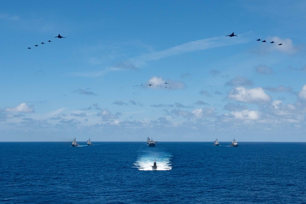 USS Ronald Reagan (CVN 76) steams in formation with 7th Fleet ships, Japan Maritime Self-Defense Force ships, as U.S. Navy, U.S. Air Force and Japan Air Self-Defense Force aircraft fly over in support of Valiant Shield 2024