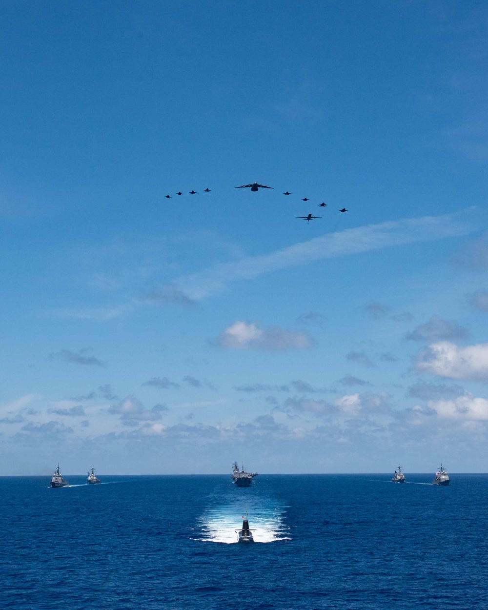 USS Ronald Reagan (CVN 76) steams in formation with 7th Fleet ships, Japan Maritime Self-Defense Force ships, as U.S. Navy, U.S. Air Force and Japan Air Self-Defense Force aircraft fly over in support of Valiant Shield 2024